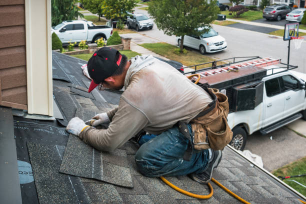 Professional Roofing technician working in Northport, NY